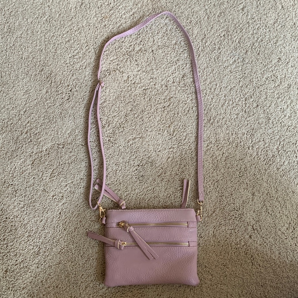 Lilac purse with 2 attachments, over the shoulder and wristlet.